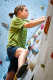 Teenage Boy Training On Climbing Wall