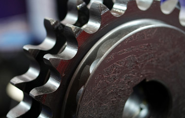  Closeup view of engine gear wheels, industrial background