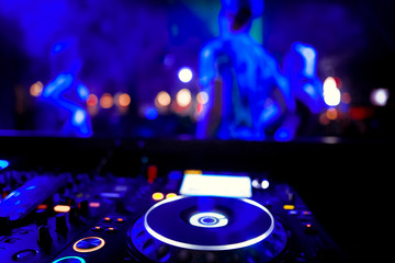 Fototapeta na wymiar DJ playing music at mixer closeup