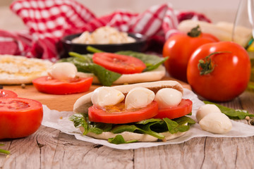 Tigella bread with spinach and tomatoes.