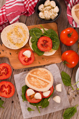 Tigella bread with spinach and tomatoes.