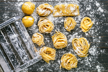 pasta with pasta ingredients on the dark wooden table top view