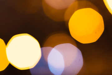 large gold and silver bokeh on a dark background