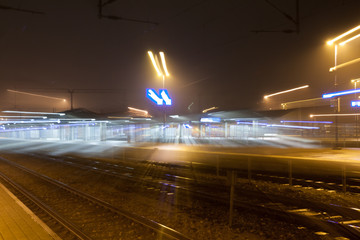 Fototapeta na wymiar Abstract night scene of Kouvola railway station in zoom blur effect.