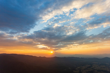 colorful dramatic sky with cloud at sunset.