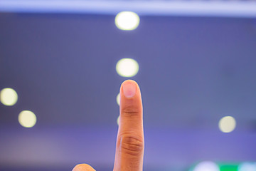 Index finger, men 26 years old, bokeh background