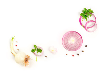 Red onions, shallots, parsley and peppercorns, shot from the top on a white background with a place for text