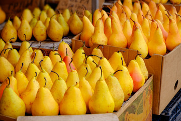 Ripe yellow pears in market