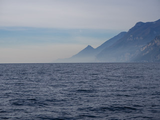 Landscape with deep blue water and mountains on the coast
