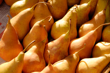 Ripe yellow pears in market