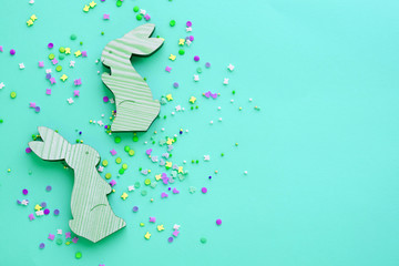 wooden toys easter bunnies on a blue background