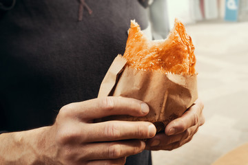 Man holds street food