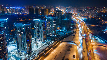 Obraz na płótnie Canvas aerial night city view and traffic cars. Drone shot