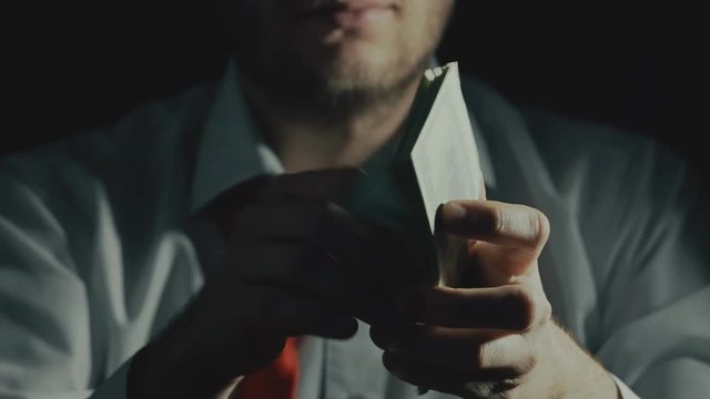 concept of corruption, bribe taker, illegal business by drug sales trade in darkness