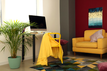Interior of room with comfortable fashion designer workplace