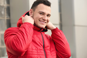 Portrait of handsome young man outdoors