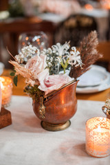 rustic wedding decorations with flowers and candles. banquet decor. picture with soft focus