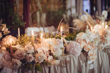 rustic wedding decorations with flowers and candles. banquet decor. picture with soft focus