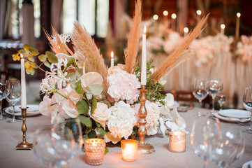 rustic wedding decorations with flowers and candles. banquet decor. picture with soft focus