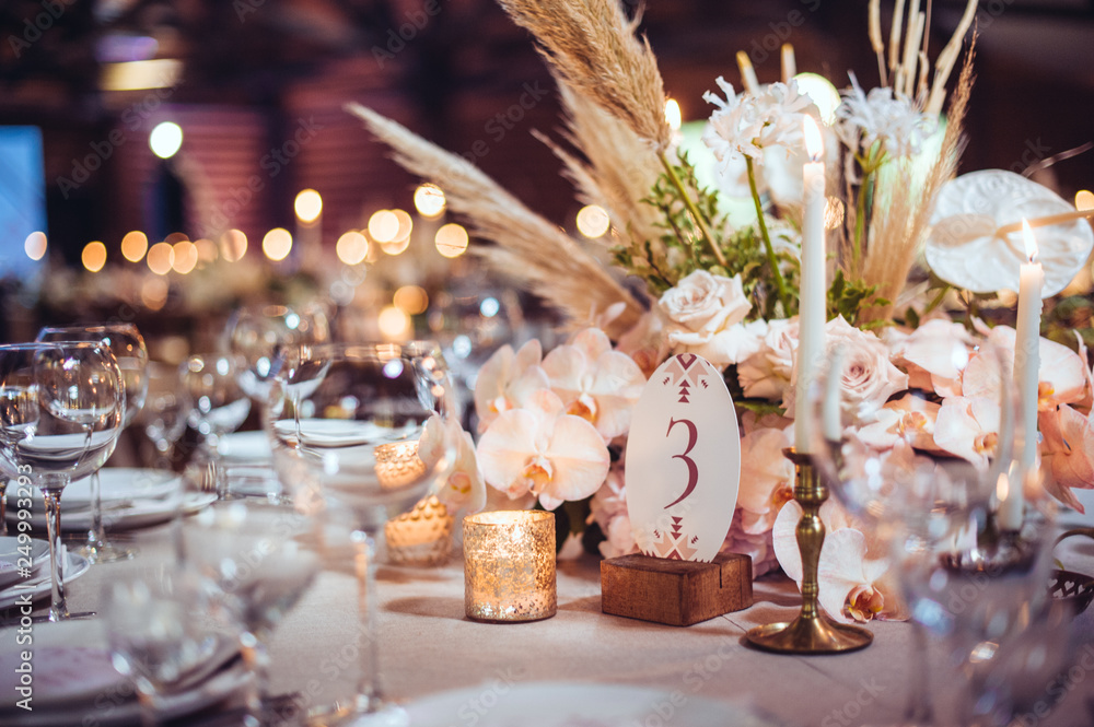 Wall mural rustic wedding decorations with flowers and candles. banquet decor. picture with soft focus