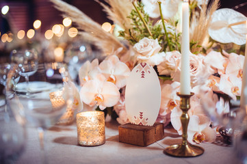 rustic wedding decorations with flowers and candles. banquet decor. picture with soft focus