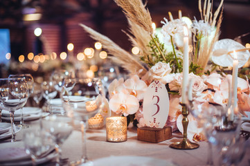 rustic wedding decorations with flowers and candles. banquet decor. picture with soft focus