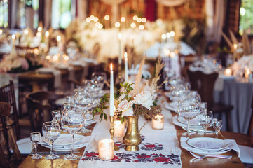 rustic wedding decorations with flowers and candles. banquet decor. picture with soft focus