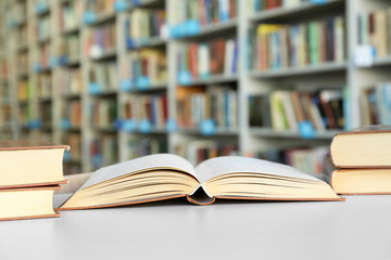 Many books on table in library
