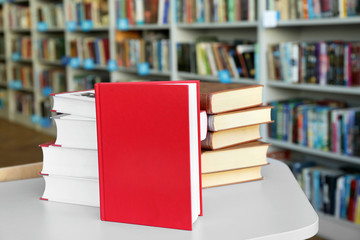 Many books on table in library