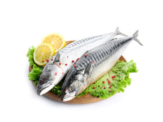 Wooden plate with tasty raw mackerel fish on white background