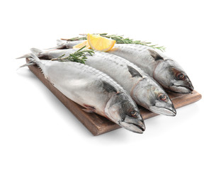 Wooden board with tasty raw mackerel fish on white background