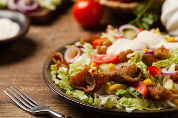 Gyros, kebeb. Salad with mutton and vegetables.