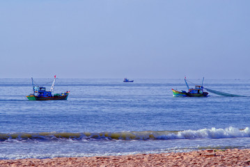 fishermen at work in the Gulf of Mui Ne