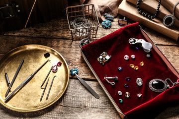 Jeweller's tools and box with adornments on table