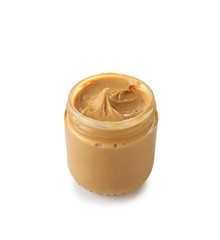 Tasty peanut butter in jar on white background