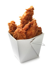 Tasty nuggets in paper box on white background