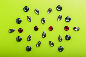 Composition with precious stones for jewellery on color background