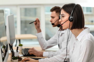 Technical support agents working in office