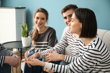 Group of young people meeting indoors