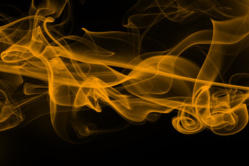 Beautiful movement yellow smoke abstract on black background, fire design