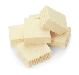 Cut tofu cheese on white background