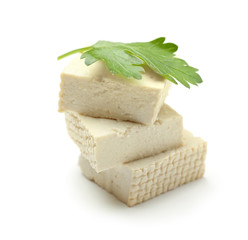 Cut tofu cheese on white background
