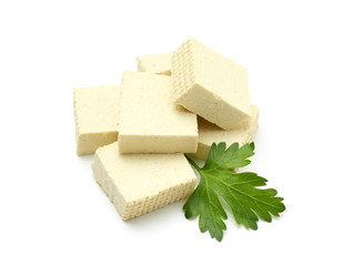 Cut tofu cheese on white background