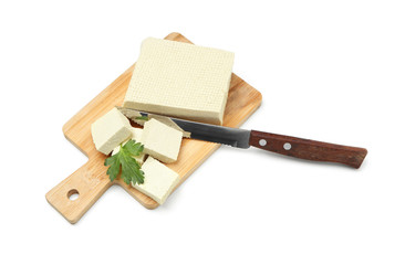 Cutting board with tasty tofu cheese on white background