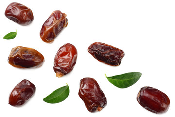 date fruits with green leaves isolated on white background. top view