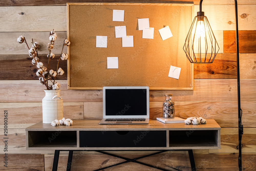 Wall mural Interior of modern room with comfortable workplace near wooden wall