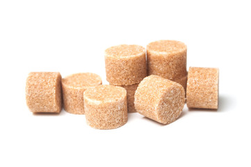 group of brown cane sugar in shaped circle on white background