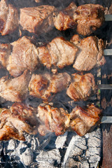 Traditional eastern dish, shish kebab. Roasted meat cooked at barbecue with smoke. .