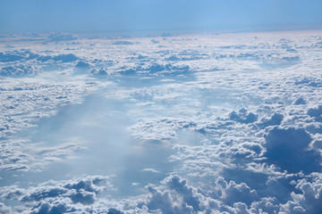 Naklejka na ściany i meble Panorama from window of plane with white clouds