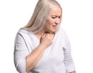 Mature woman having asthma attack on white background